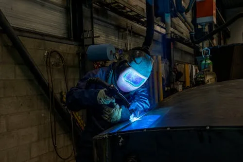 Welder fabricating a custom sign