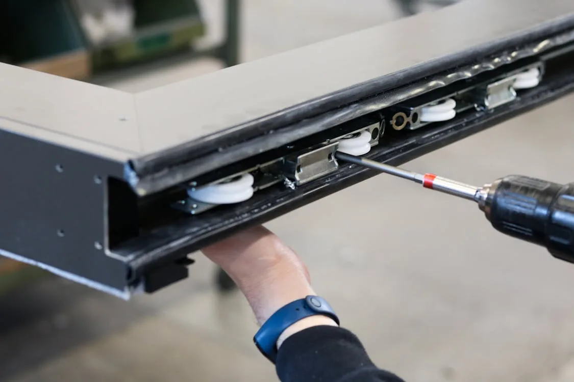 A technician maintaining a large-format printer